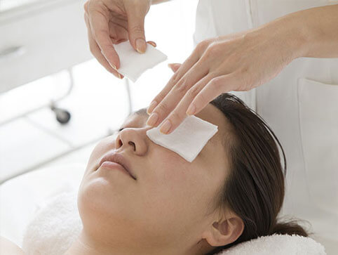 Woman with protection on her eyes after PRK surgery